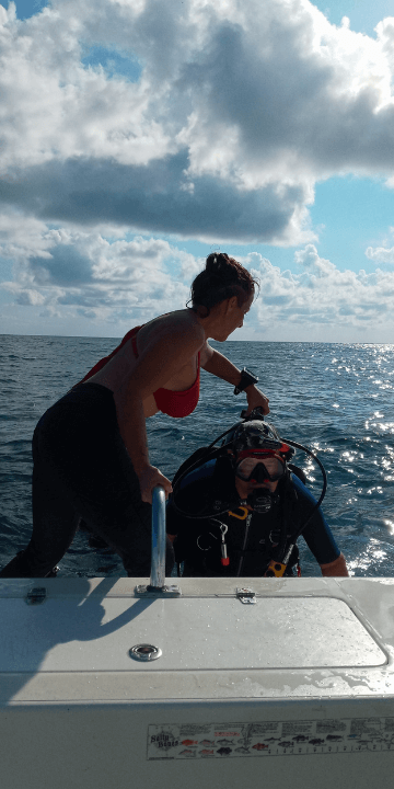 Divemaster Ashley Colyer Helping Diver Out 360x720