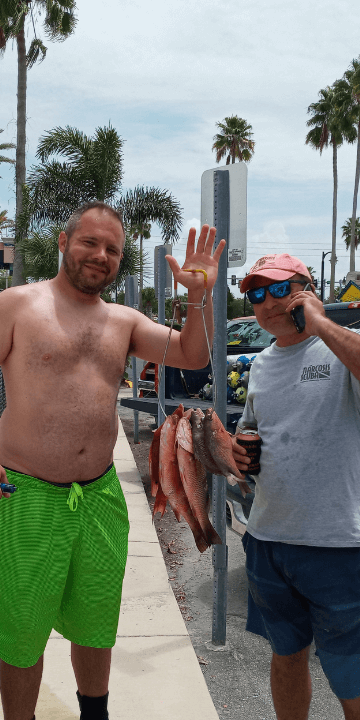 Bringing Back a Stringer of Fresh Fish to Tarpon Springs Florida 360x720