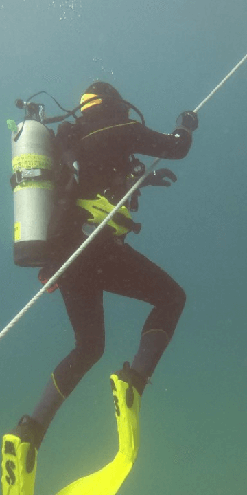 SCUBA Diver Following the Anchor Cable Back to the Narcosis